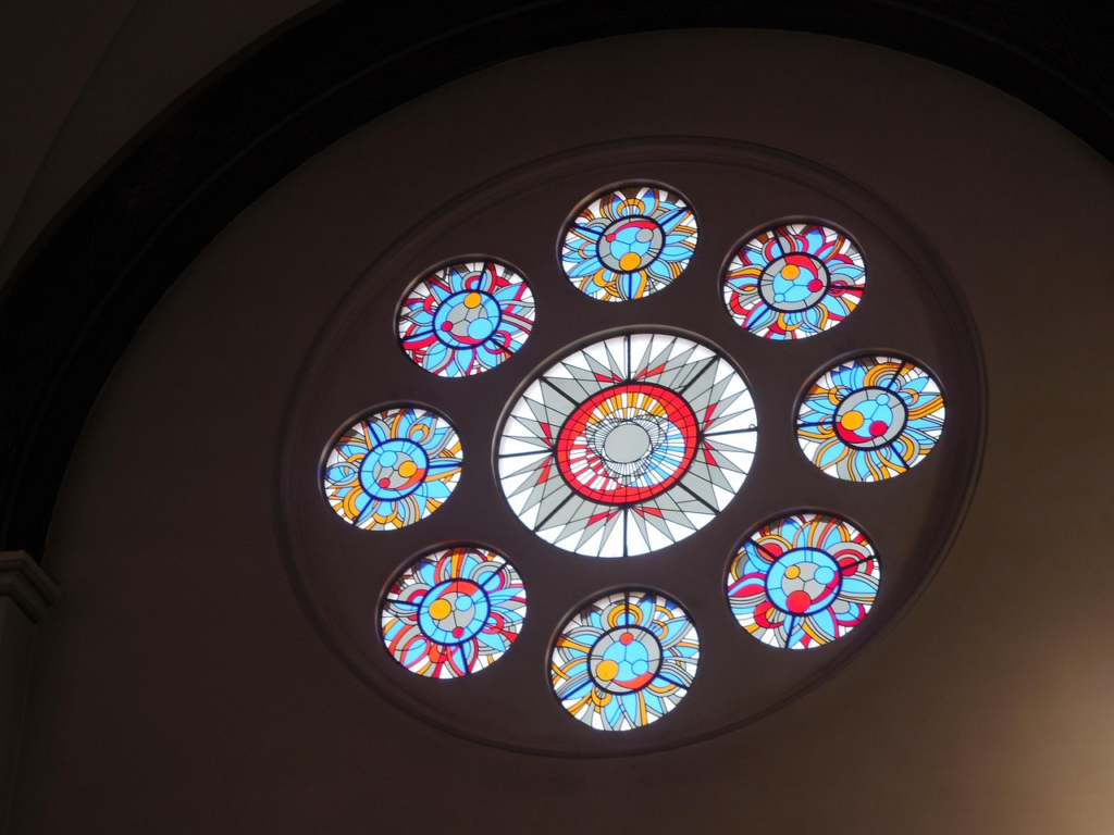 Wall with circle stain glass windows
